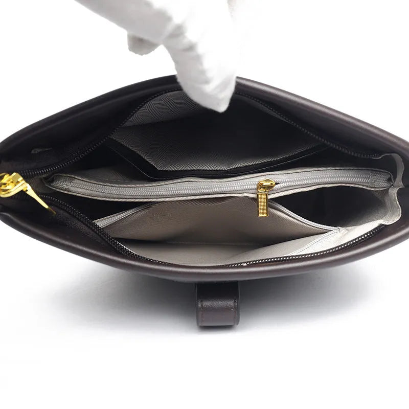 Black PU leather bucket bag with double shoulder straps showing internal compartments and external pocket