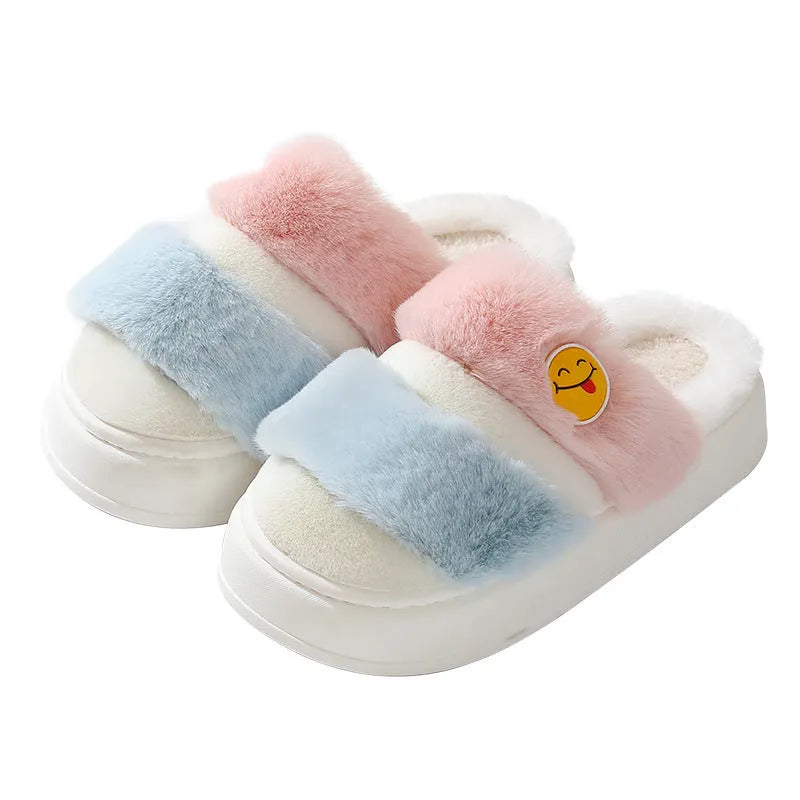 Pink and green cartoon thermal cotton slippers with plush upper and non-slip sole.