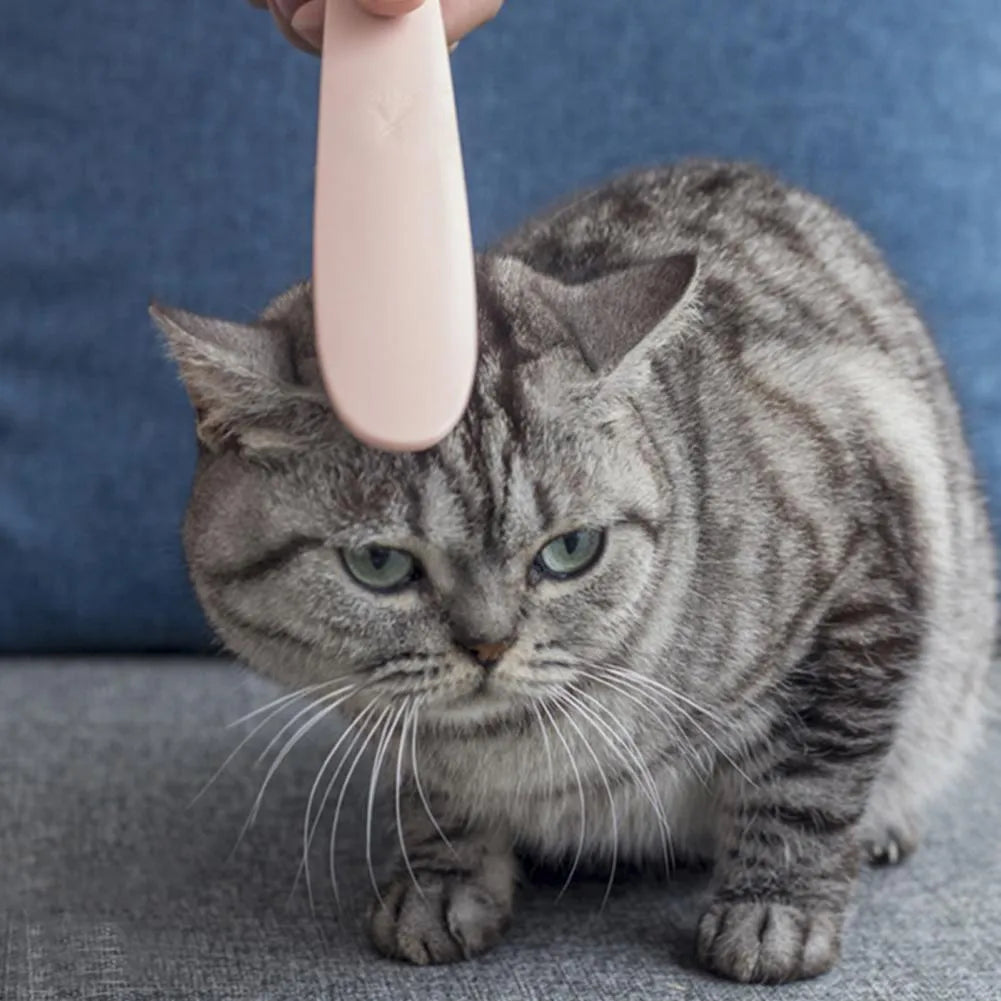 Grey and pink cat grooming combs with tongue massager design and dual ends