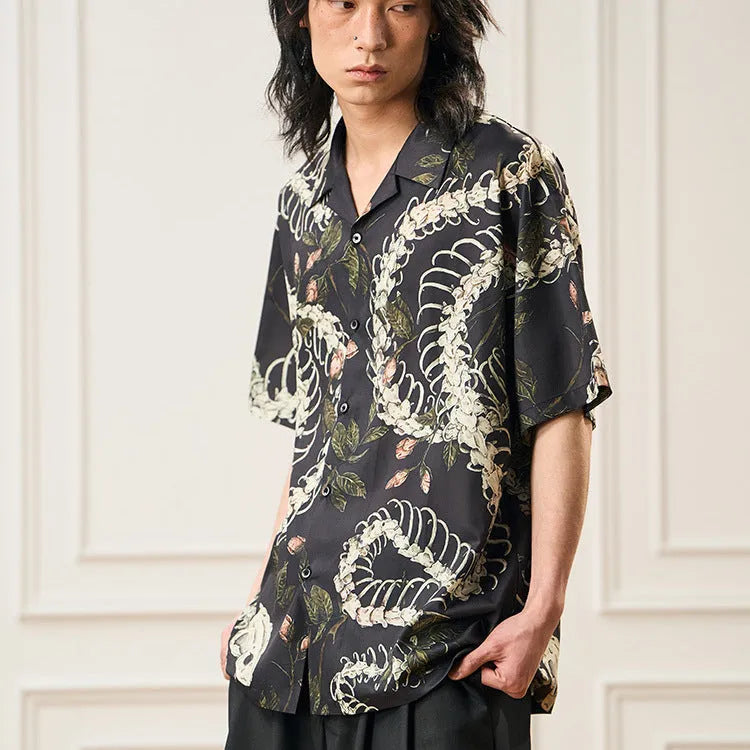 Short sleeve Cuban collar shirt with snake bone and floral pattern print in a loose fit.