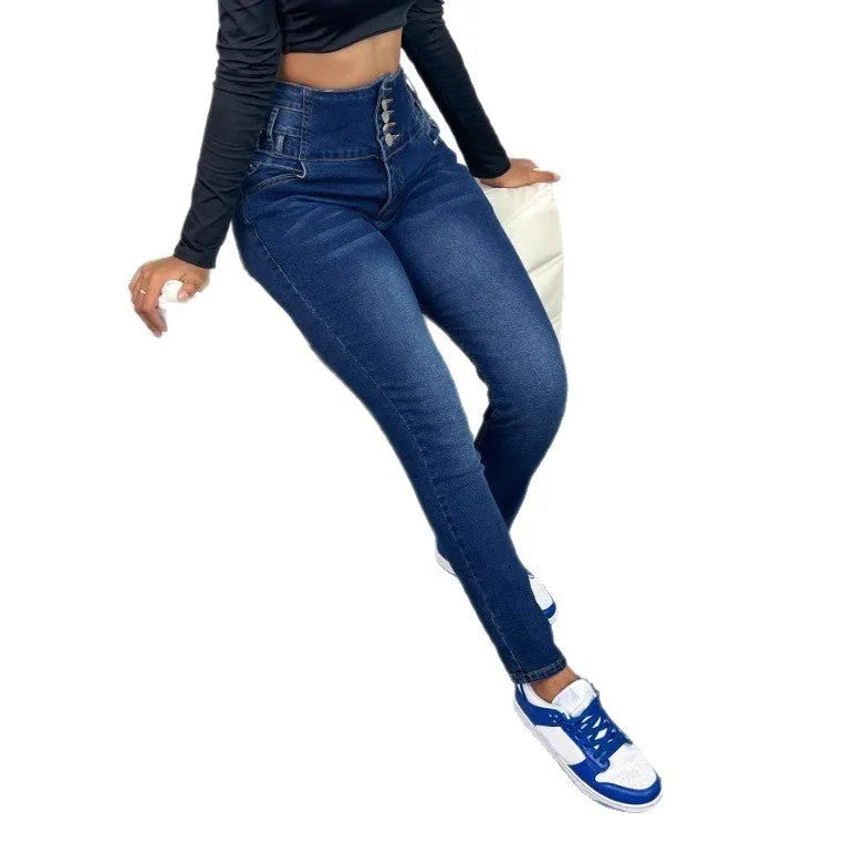 Dark blue women's straight-leg denim trousers with button details on a hanger.