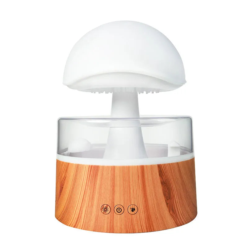 White Rain Cloud Humidifier showing raindrop effect, colour-changing light, and remote control on a table.
