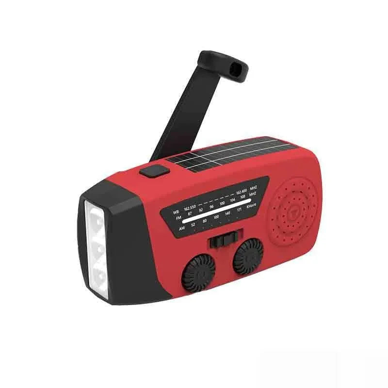 Red rechargeable emergency hand radio and torch with USB port, wrist strap, and display screen.
