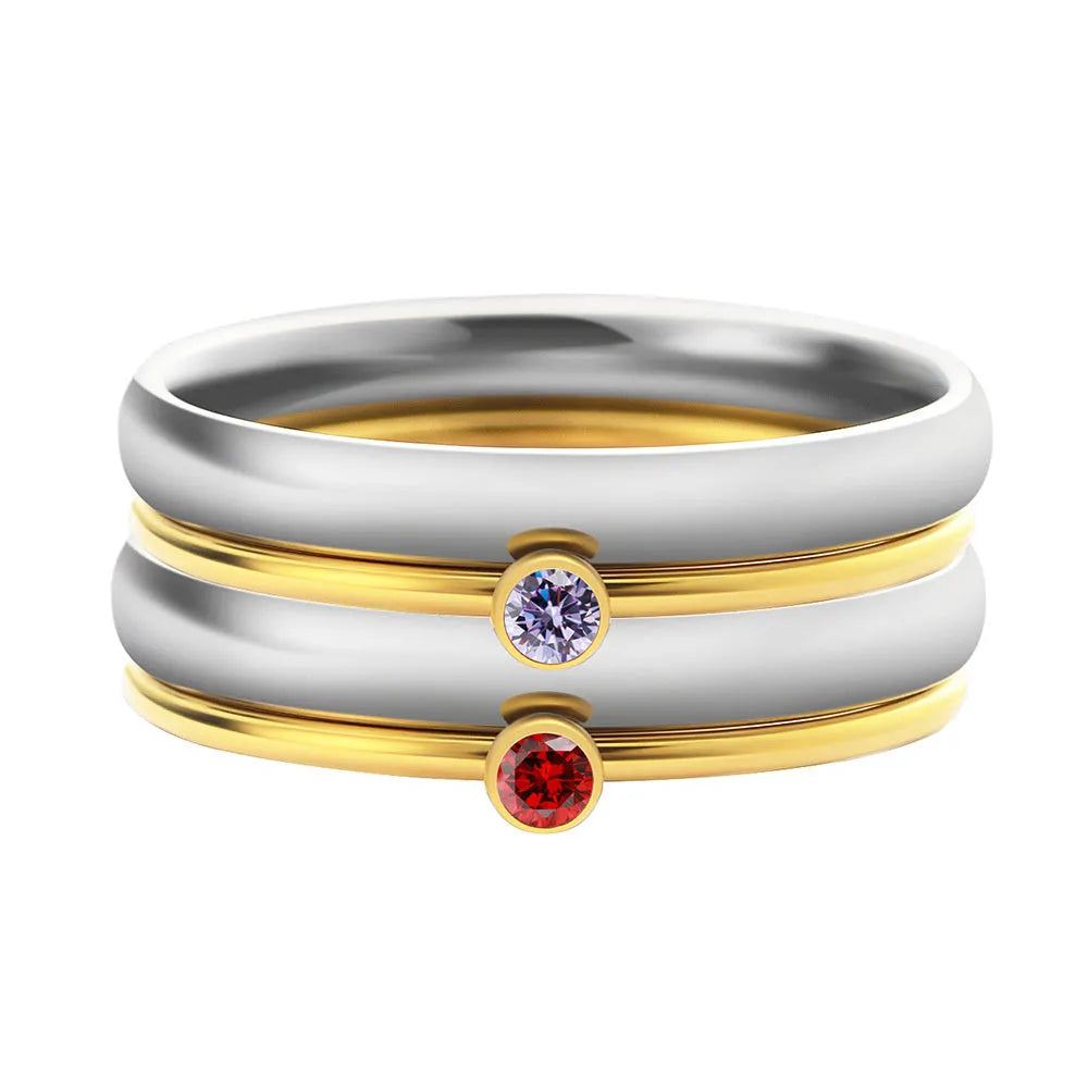 A geometric engraved titanium steel ring with a December birthstone, shown in UK ring sizes.