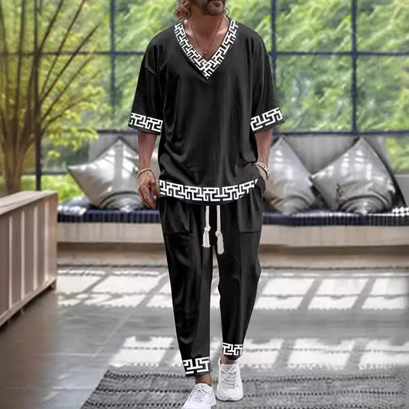 Mens grey cropped sleeve V-neck jacket and matching trousers suit on a hanger.