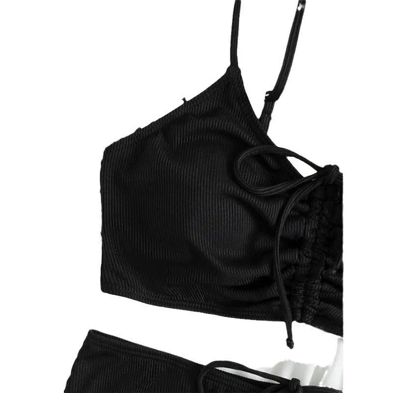 Black women's high-waisted bikini with sling split shorts and sleeveless top