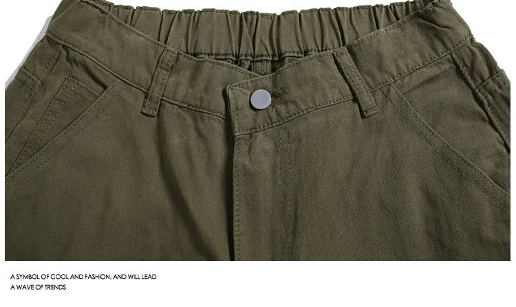 Casual wide-leg cropped workwear shorts in apricot colour with a mid waist and rivet detail