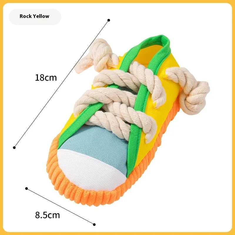 Plastic dog chew toy with sound squeaker in bendable slipper design for dental care