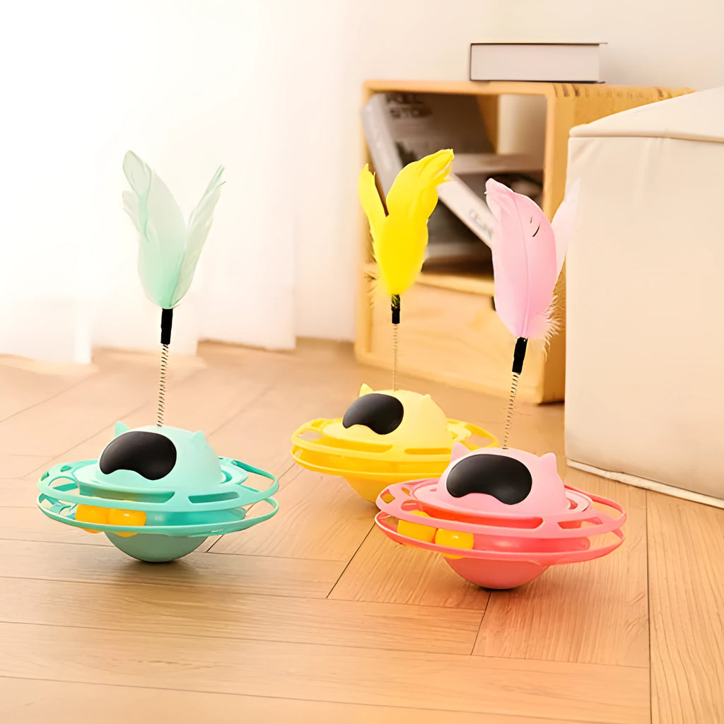 Pink plastic cat tumbler turntable toy with colourful balls measuring 17x10cm