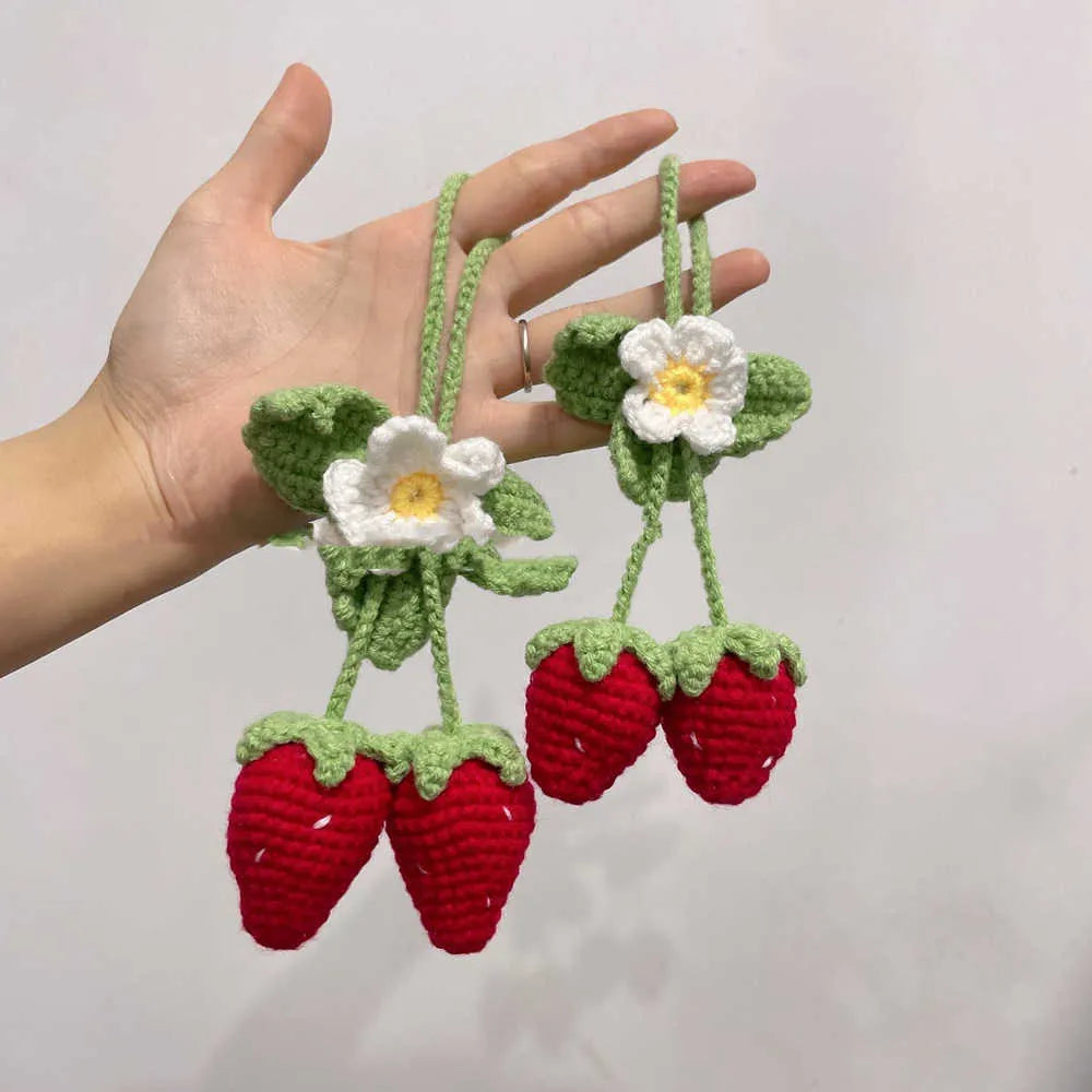Handmade strawberry-shaped car pendant made from knitted cotton and hemp wool.