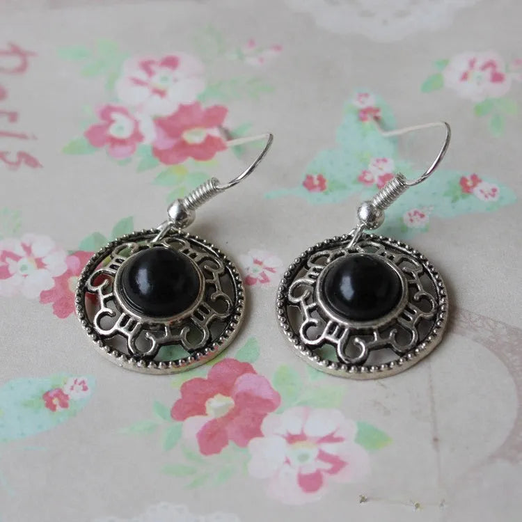 Ethnic Miao silver earrings with turquoise flower disk and geometric auspicious patterns