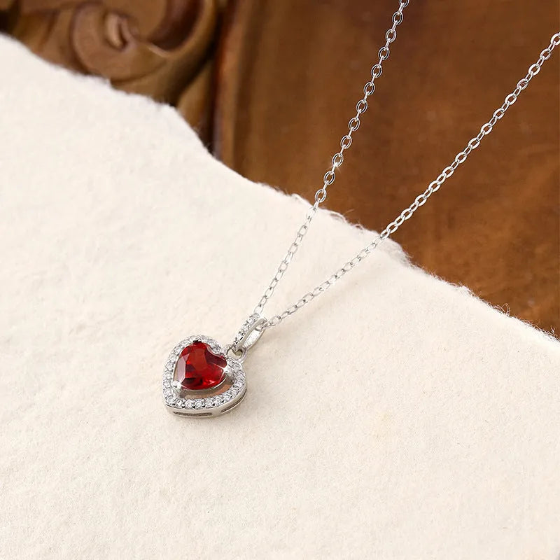 Sterling silver heart pendant necklace with a choice of coloured gemstones on a cross chain.