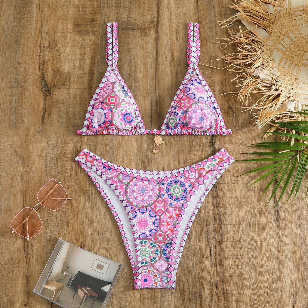 Retro four-colour print women's bikini swimwear in briefs style on a mannequin.