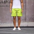 Men's loose-fitting workwear shorts in army green colour with a straight leg and elasticated waistband