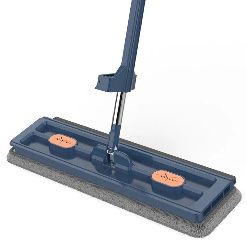 Large flat mop with blue rotating head and long stainless steel handle on a wooden floor