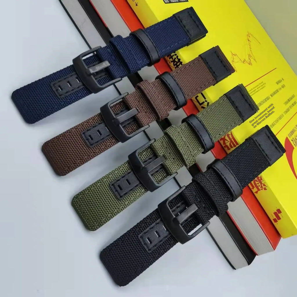 Oxford cloth replacement watch strap shown in multiple colour options including camouflage, black, and army green.