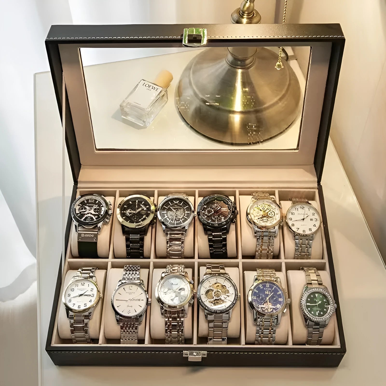Leather watch storage box with clear dustproof lid showing multiple watch compartments