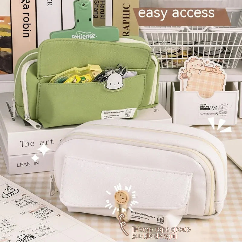 Large capacity Korean-style canvas pencil case for girls in green, holding multiple pens.