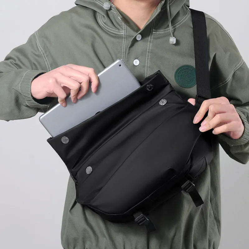 Grey PU men's crossbody sling backpack with a phone pocket on a mannequin.