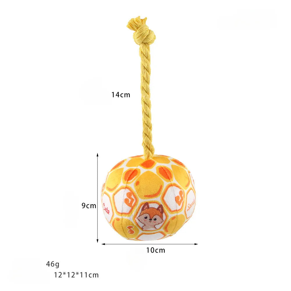 Elastic football design dog toy with cotton rope exterior and squeaker ball
