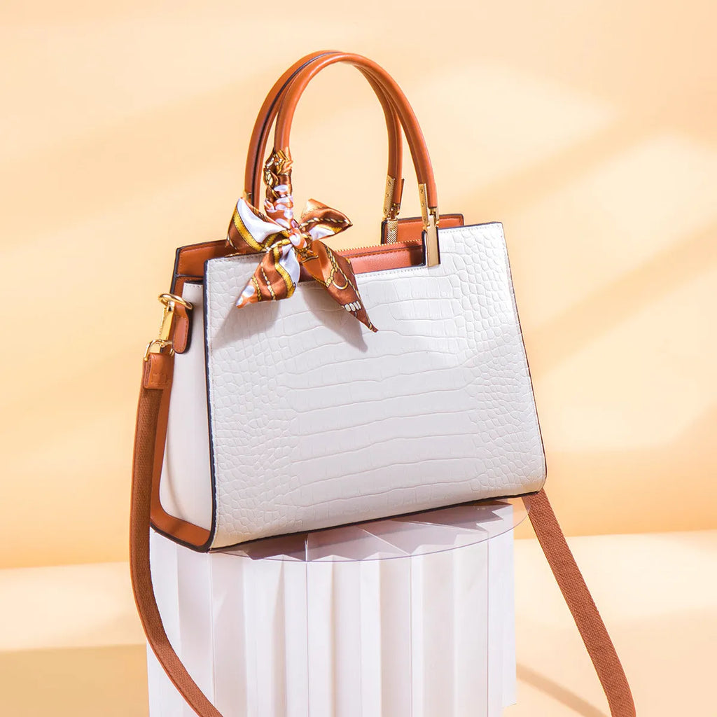 Milky white women's PU leather shoulder handbag with interior organisation pockets in horizontal square shape.