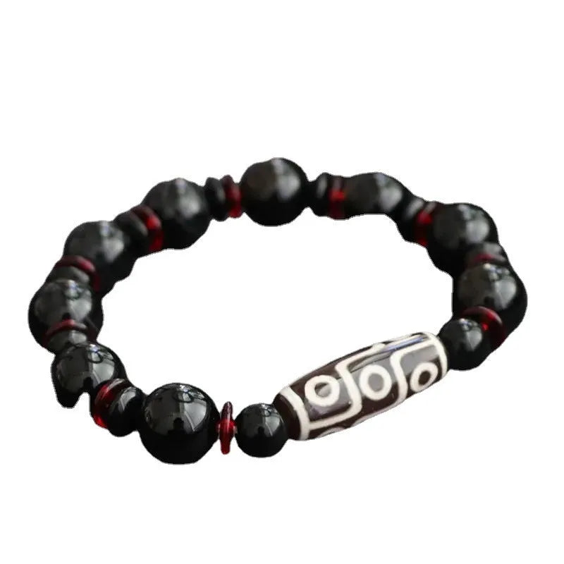Black agate dzi bead bracelet with hand-woven construction and 11mm geometry beads