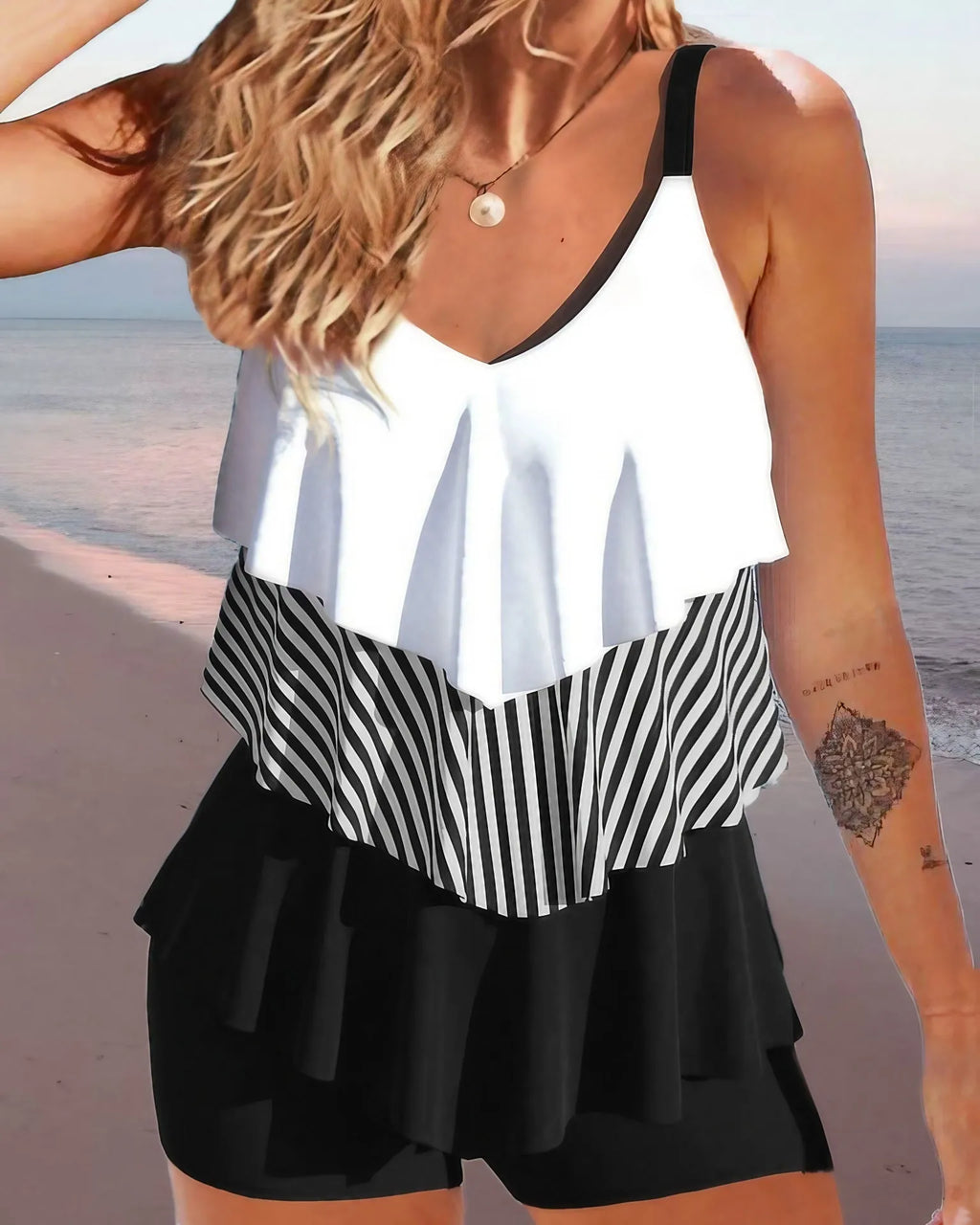 Women's sleeveless backless bikini swimsuit with spaghetti straps and ruffle detailing