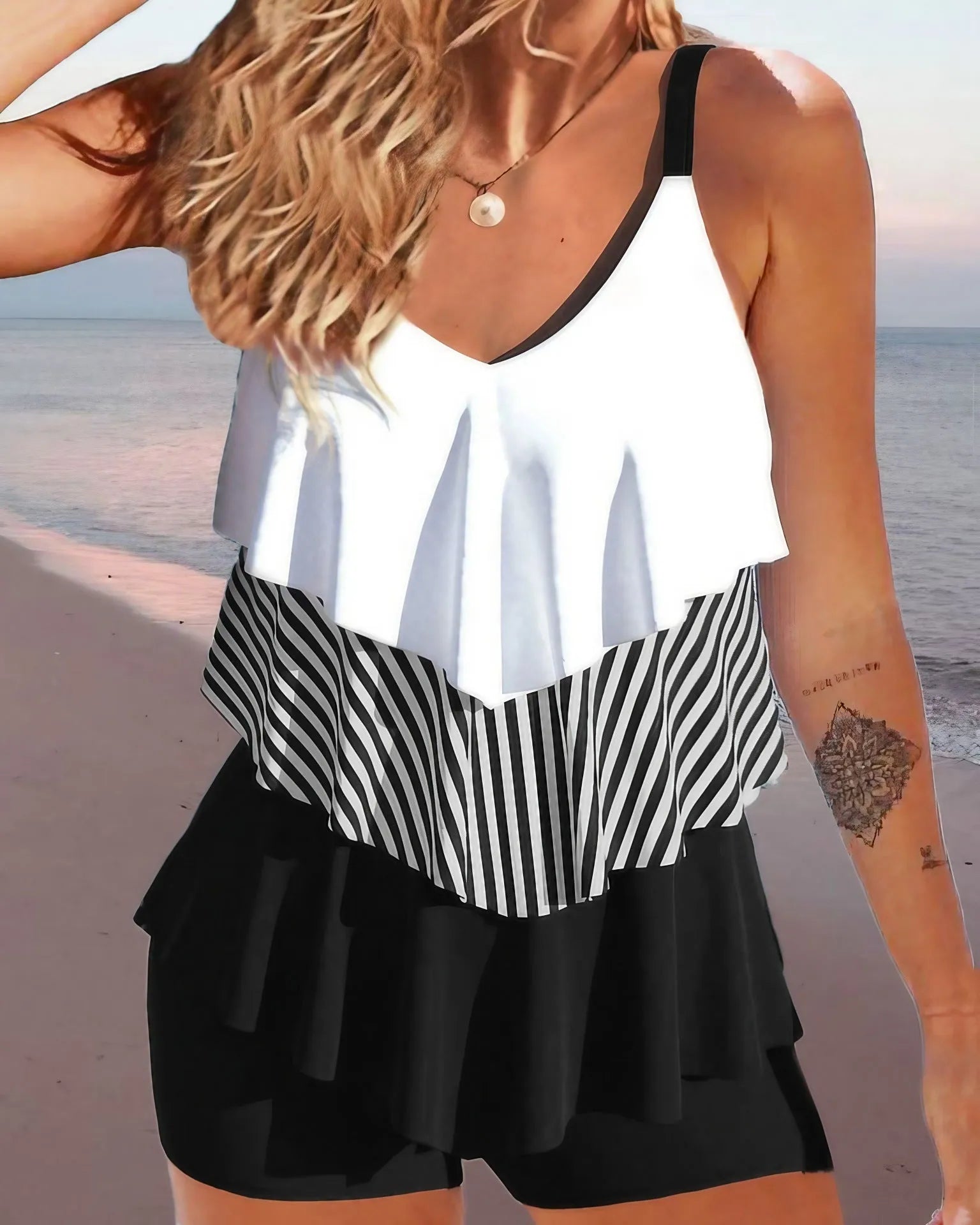 Women's sleeveless backless bikini swimsuit with spaghetti straps and ruffle detailing
