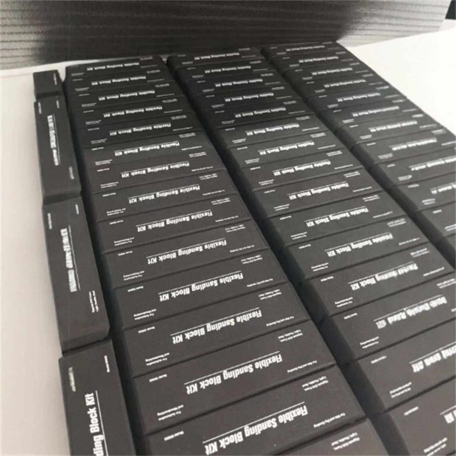 Seven black frosted EVA display blocks with metal reinforcement arranged in stacked configuration