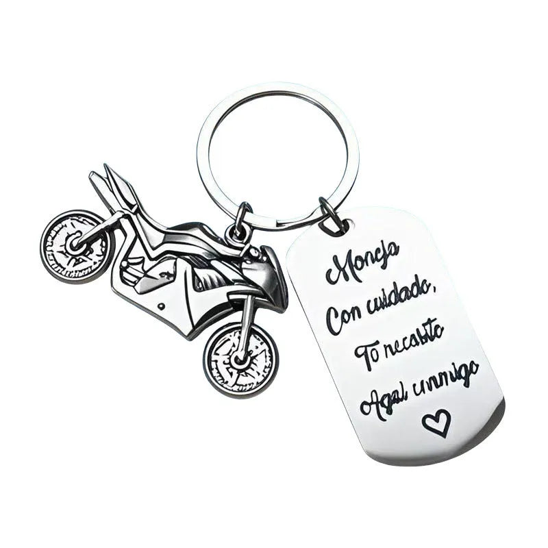 Stainless steel motorcycle key ring with modern design presented with a velvet pouch.