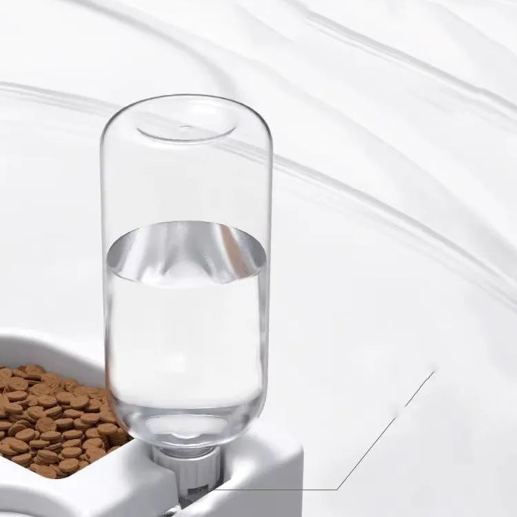 White automatic pet water fountain for cats and dogs on a floor.
