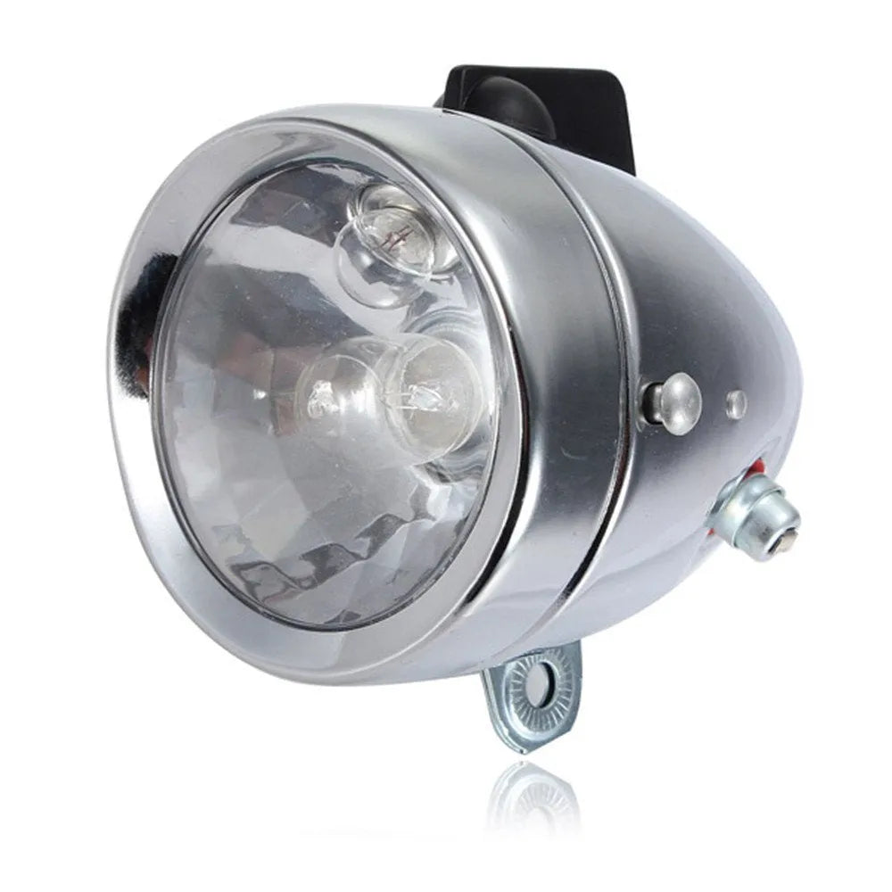 Silver bicycle dynamo light kit with generator head for friction drive mounting on bicycle frame