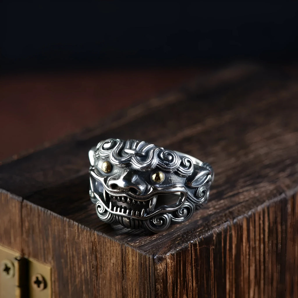 Silver open style ring with a detailed jibeast animal zodiac pattern.