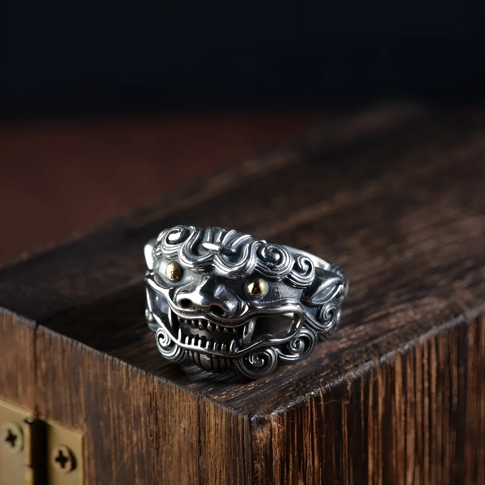 Silver open style ring with a detailed jibeast animal zodiac pattern.
