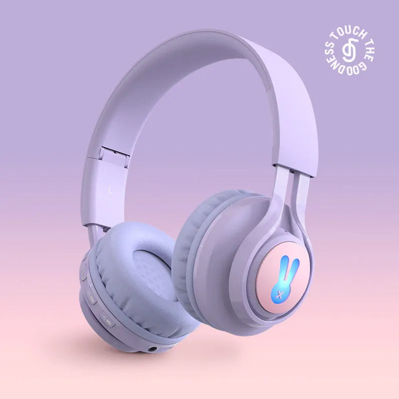 Wireless RGB children's headphones in bunny pink colour with lights on