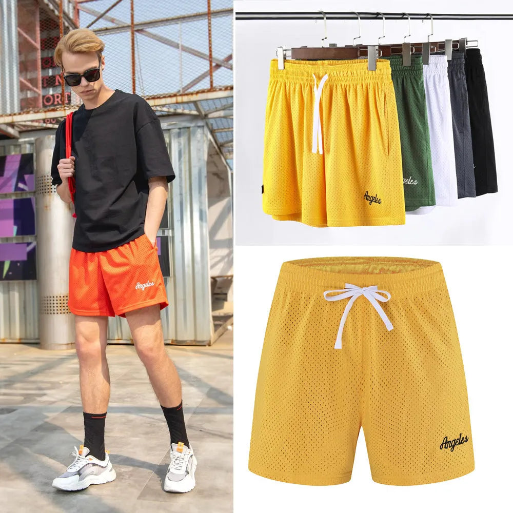 Men's black double-layer mesh sports shorts laid flat, showing mesh panel detail and shorts length.