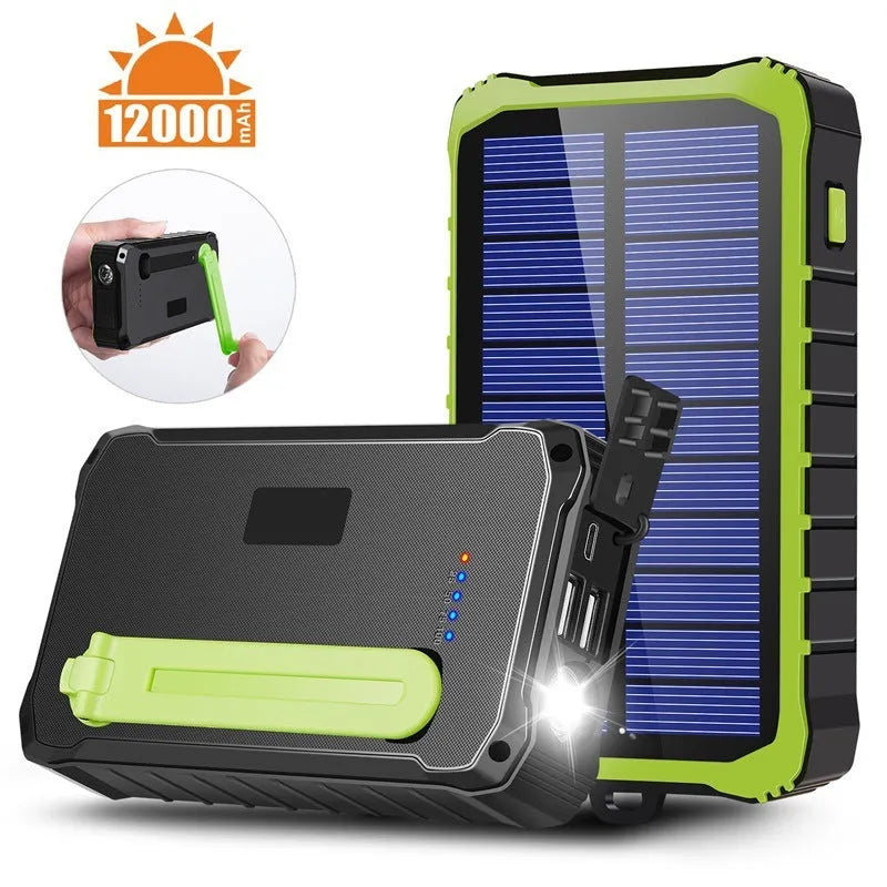 Orange and green hand-crank solar power bank with LED torch and dual USB ports showing 12000mAh capacity