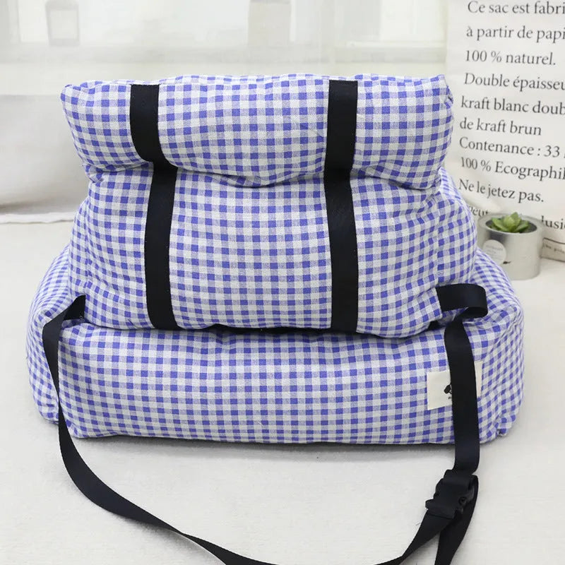 Car-mounted pet outing nest in stain-resistant cloth showing grey and blue plaid colour options