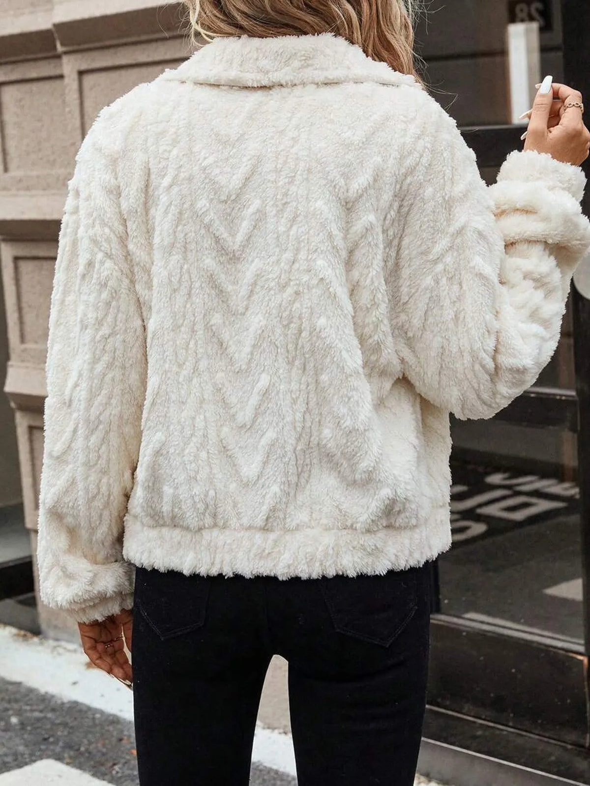 Ivory white women's plush cardigan coat with button front closure.