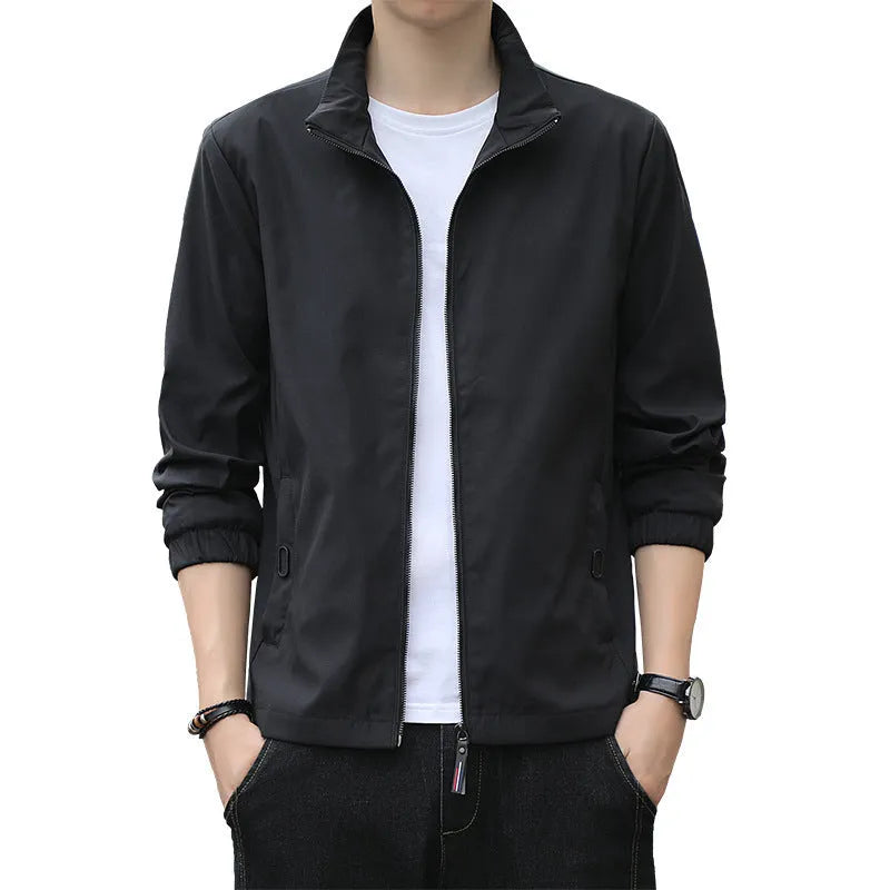 Man wearing a black Korean-style loose lapel casual jacket with zipper pockets