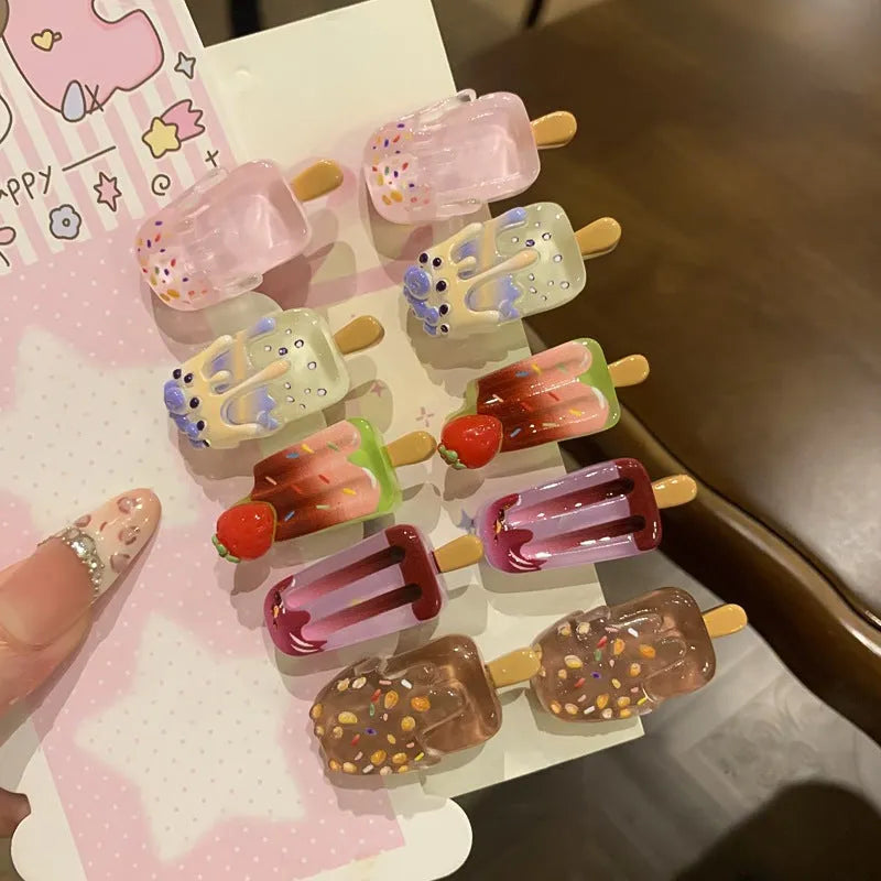 Close-up of a resin hair clip with a cartoon ice cream design in a choice of five colours.