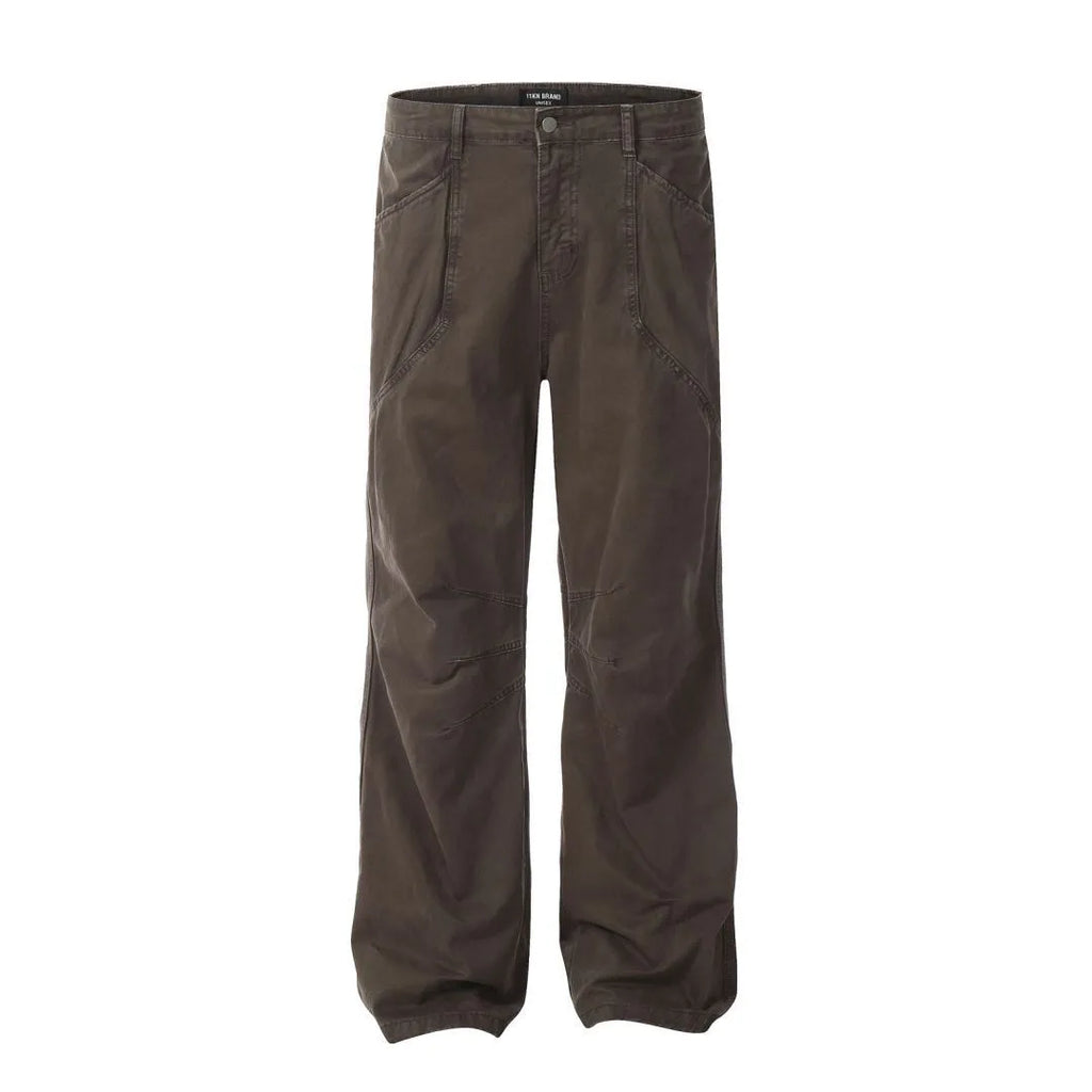 Men's brown loose fit straight leg cotton jeans with a high waist and zip fly on a hanger.