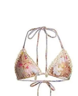 Women's creamy-white floral pattern bikini swimsuit set with top, briefs, and skirt
