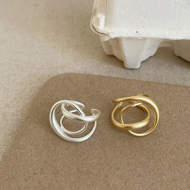 Three-dimensional interlaced geometric open ring in matte metal with gold or silver plating
