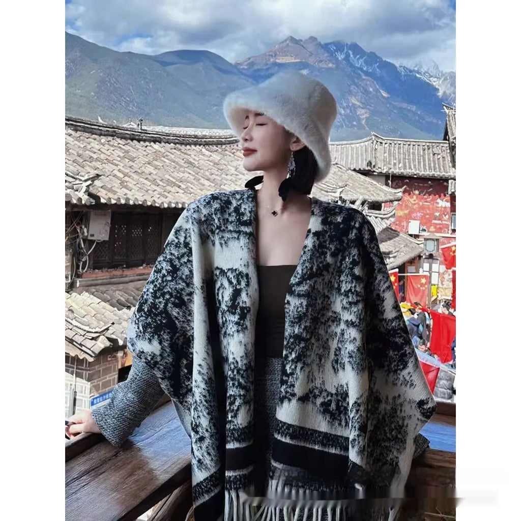 Women's polyester scarf cape with tassel fringe detail draped over shoulders