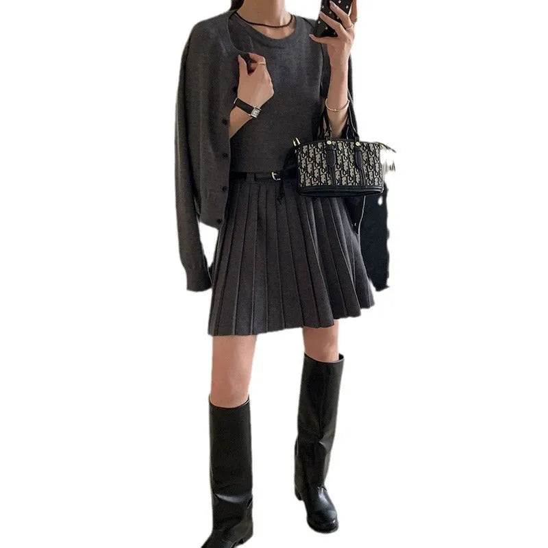 Grey art retro women's vest skirt and long-sleeve cardigan two-piece set with pleats and belt.