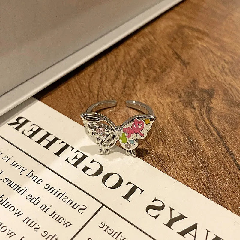 Butterfly women's copper ring with adjustable split ring design showing oil-drip colour treatment
