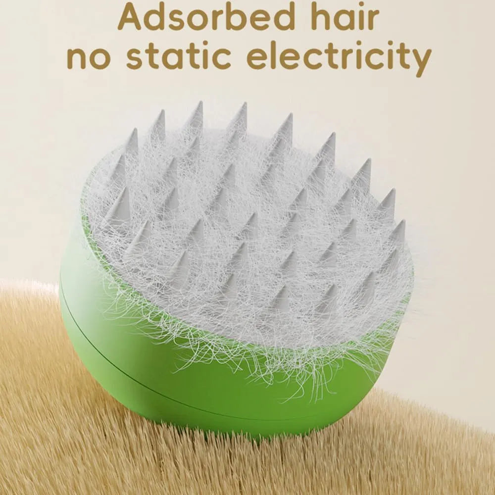 Green and yellow rechargeable silicone steam brush for grooming cats and dogs on a white background.