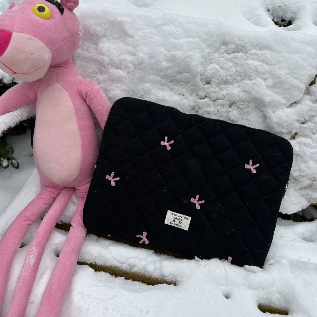 Nylon laptop storage bag with rhombus embroidery and bow in light blue, showing front detail