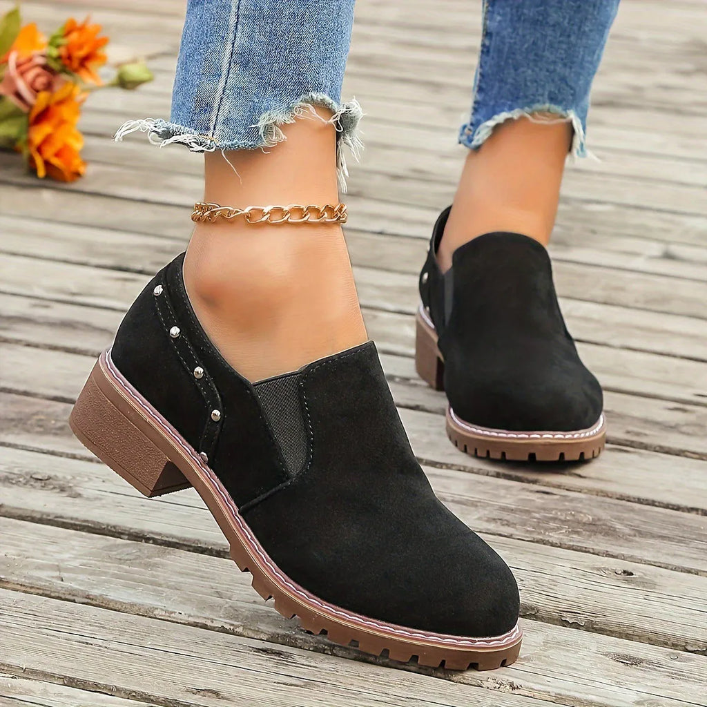 Women's light brown suede ankle boots with elastic band and thick low heel on rubber sole